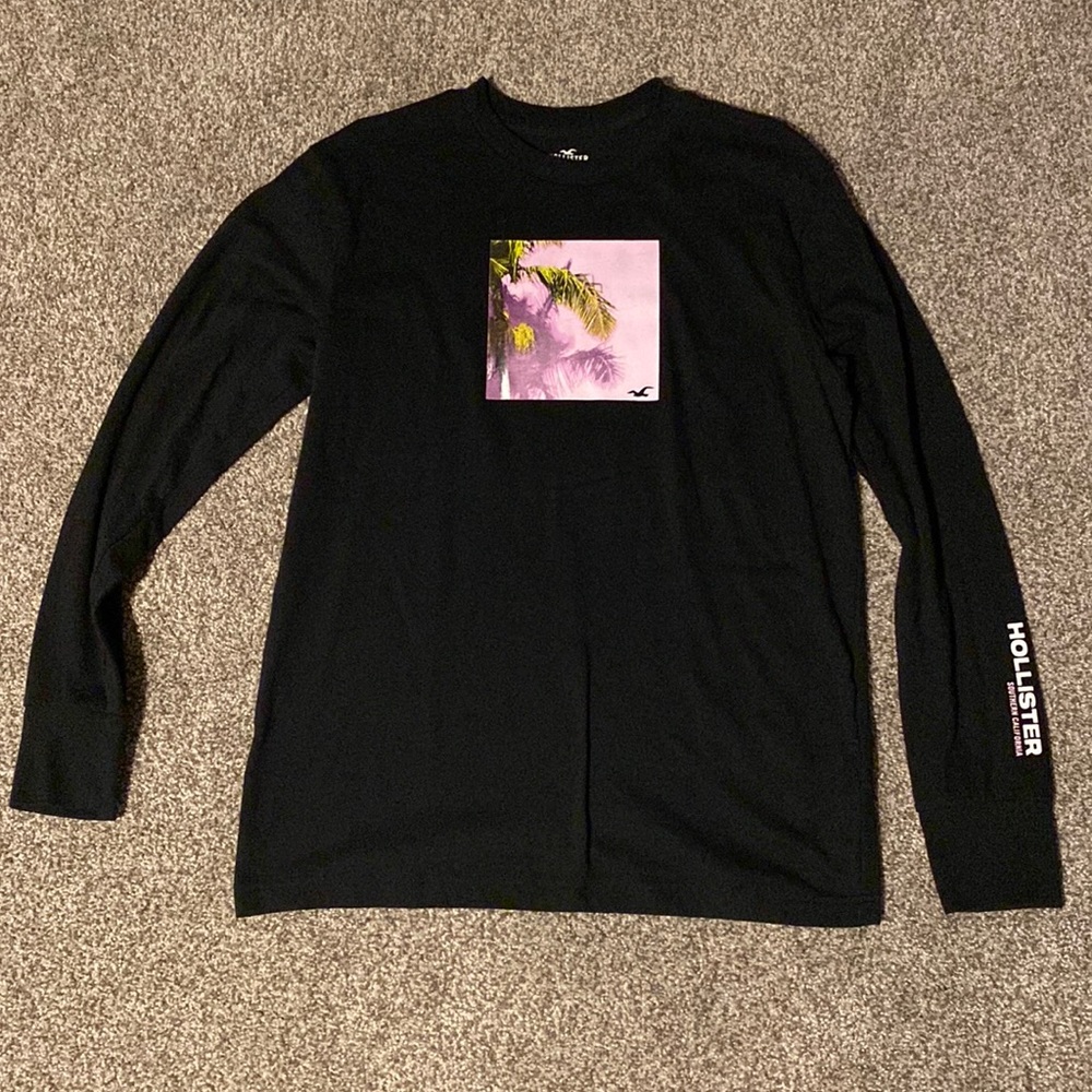 Medium black long sleeved Hollister t-shirt with pink palm tree graphic.